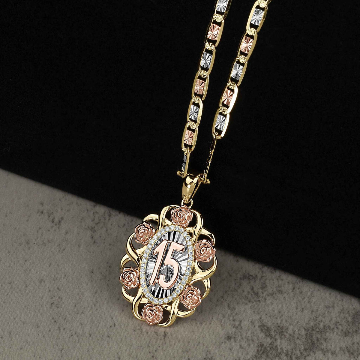Quinceañera tri-color gold pendant and chain featuring roses, cubic zirconia, and the number 15.