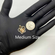 Medium size two-tone gold Quinceañera butterfly pendant next to US quarter for scale.