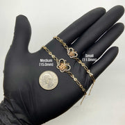 Comparison shot of small and medium gold Quinceañera 15 butterfly bracelets held on hand.