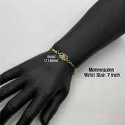 Small 11.0mm gold Quinceañera butterfly charm bracelet worn on a 7-inch mannequin wrist.