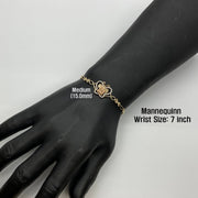Medium 15.0mm gold Quinceañera butterfly charm bracelet worn on a 7-inch mannequin wrist