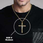 Man wearing Size 6 gold crucifix pendant necklace highlighted against a black shirt.