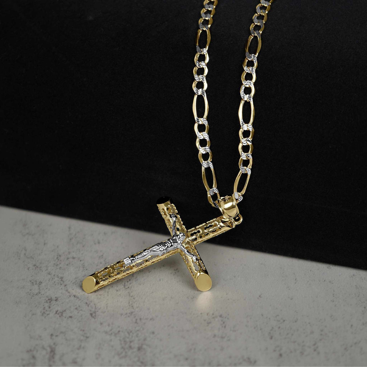 Gold Relic INRI two-tone crucifix pendant on a diamond-cut Figaro chain.