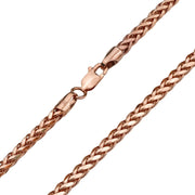 Close-up of a rose gold wheat palm chain bracelet with a lobster clasp.