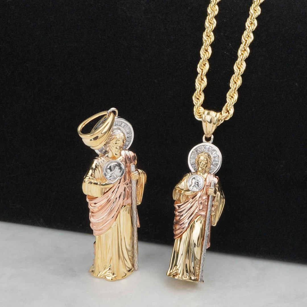 Tri-color gold 3D San Judas pendants displayed upright and hanging on a chain.
