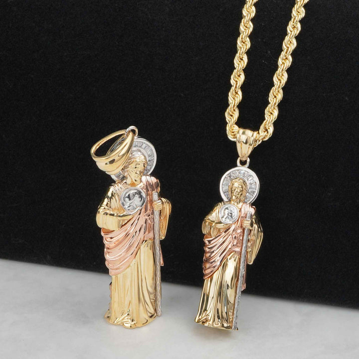 Tri-color gold 3D San Judas pendants displayed upright and hanging on a chain.