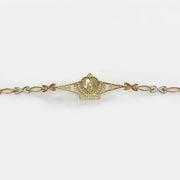 Gold Quinceañera crown charm bracelet displayed horizontally on a plain background.