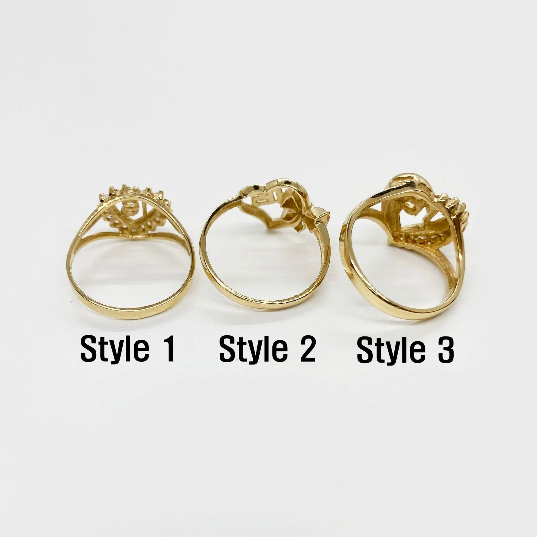 Three 10k - 14k gold Sweet 16 Heart ring with different styles back view.
