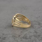 10k - 14k Gold ring with heart design and Cubic Zirconia side view on a gray surface