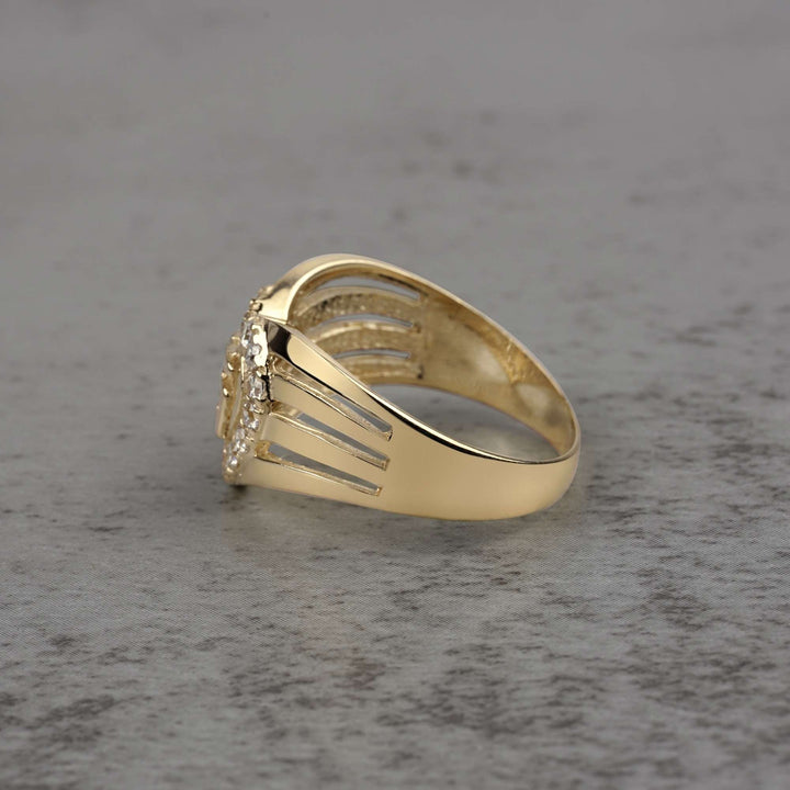 10k - 14k Gold ring with heart design and Cubic Zirconia side view on a gray surface