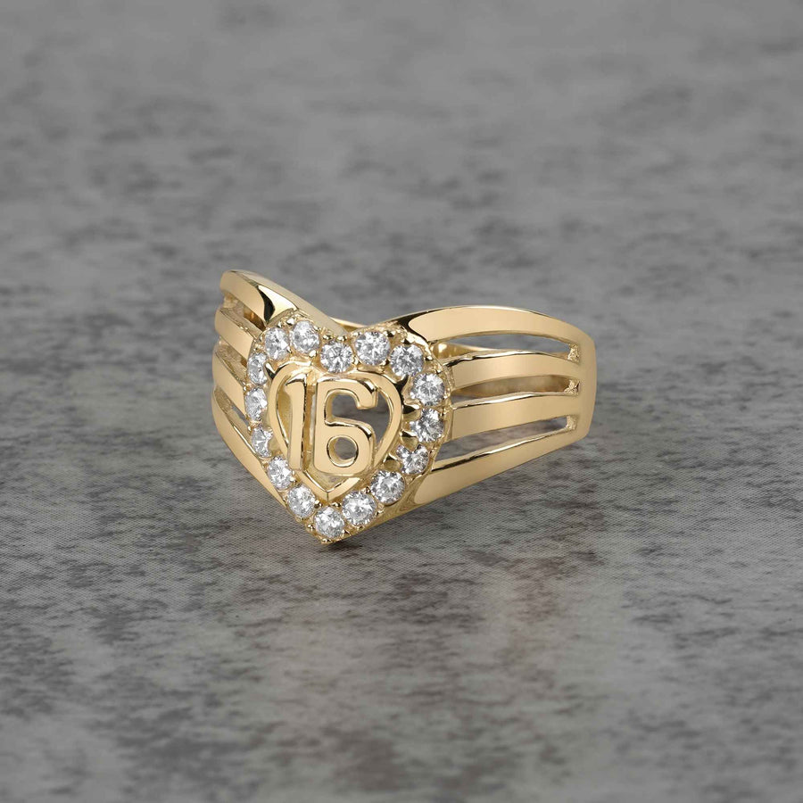 10k - 14k Gold ring with heart design and number 16 on a gray background