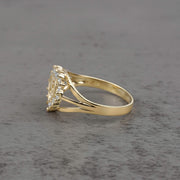 10k - 14k gold ring with a cubic zirconia side view on a gray surface