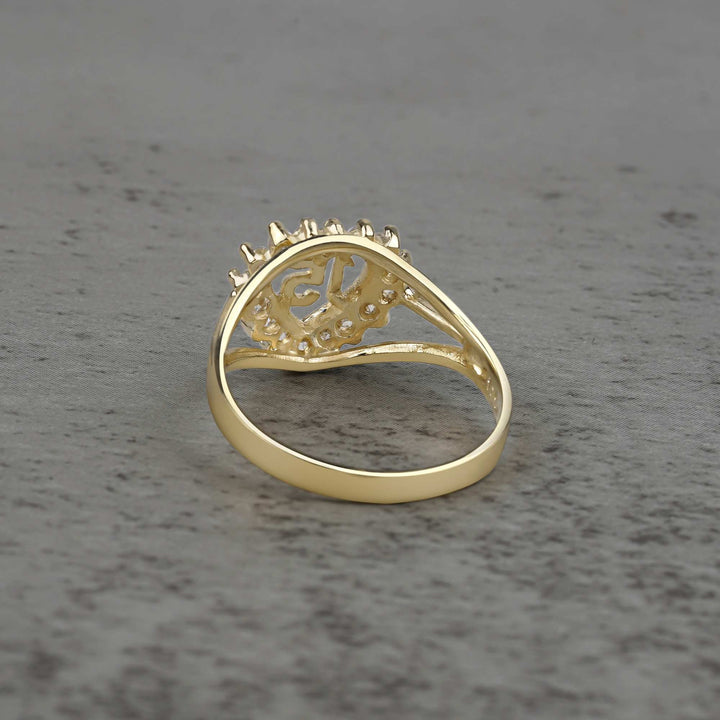 10k - 14k Gold ring with heart and number 15 design back view on a gray surface