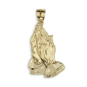 Solid yellow gold praying hands pendant isolated on a white background.