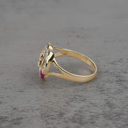 10k - 14k quinceañera gold ring with a cubic zirconia on a gray surface