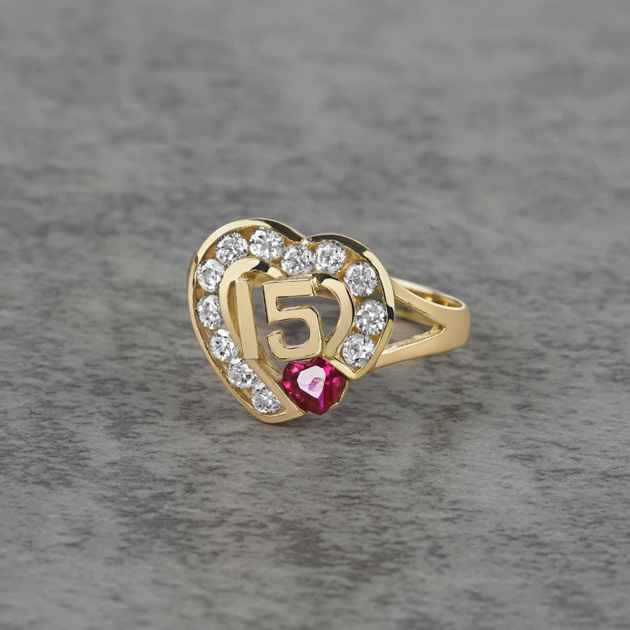 10k - 14k Gold ring with heart design and number 15 on a gray background