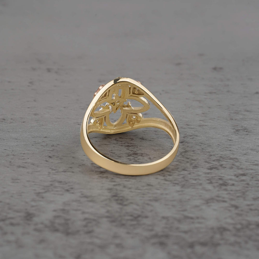 10k - 14k Gold ring with floral design  back view on a gray surface