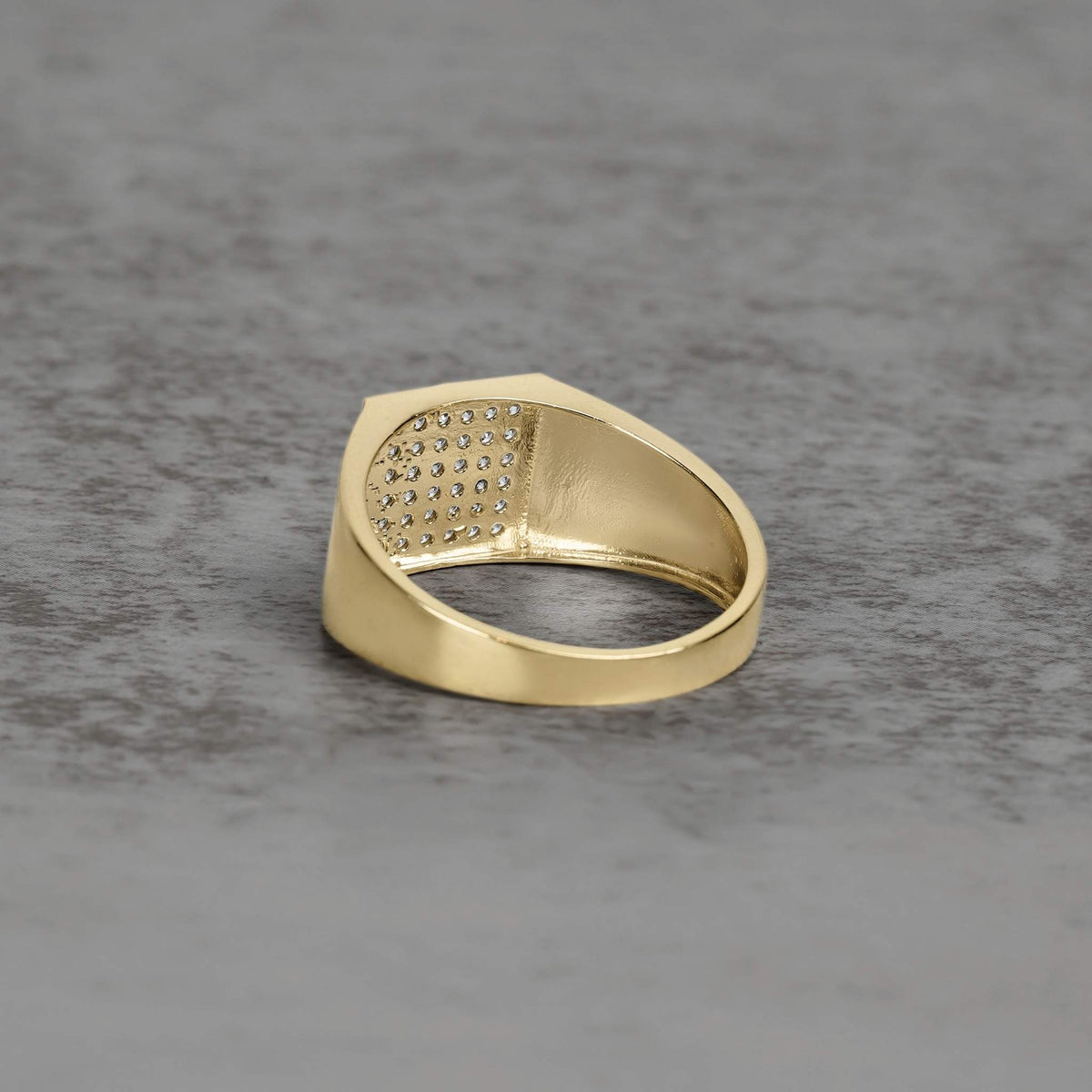 Inside band view of the 10k & 14k Square Signet Bling Classic Ring resting on slate.