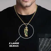 Man in black shirt showcasing an extra large gold San Judas pendant with size text.