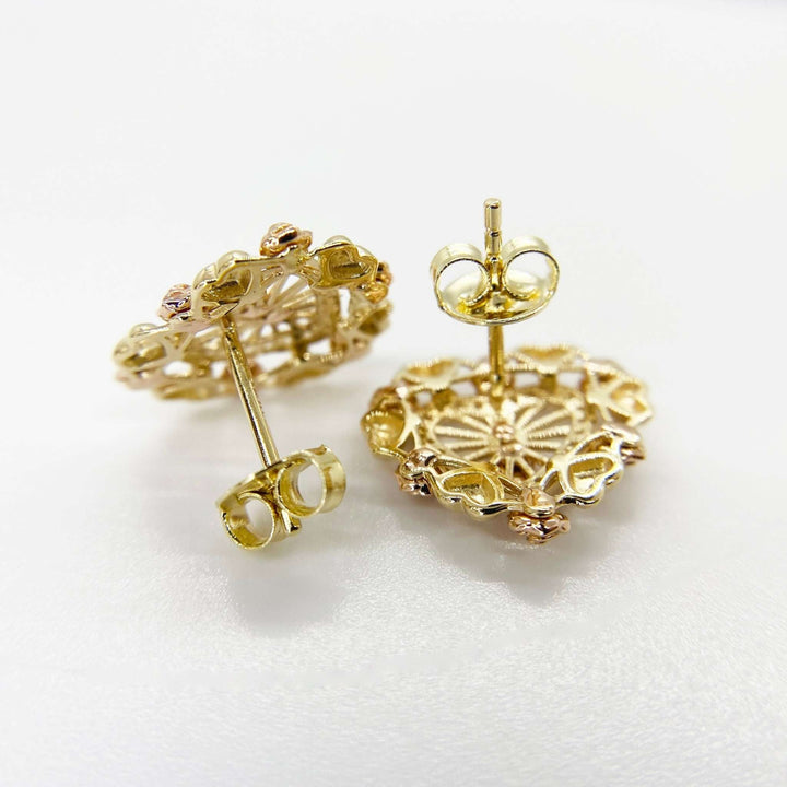 Reverse side of gold Lady of Guadalupe heart stud earrings with secure push-back closures.