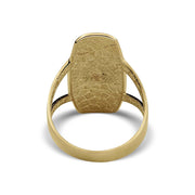 Back view of gold Virgin Mary rounded rectangle signet ring on a white background.