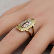 Gold tricolor Virgin Mary rounded rectangle ring being worn on a hand.