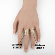 Size comparison guide of gold Virgin Mary rings on a hand with millimeter labels.