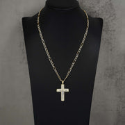 Gold crucifix pendant encrusted with cubic zirconia, displayed on a black jewelry bust.
