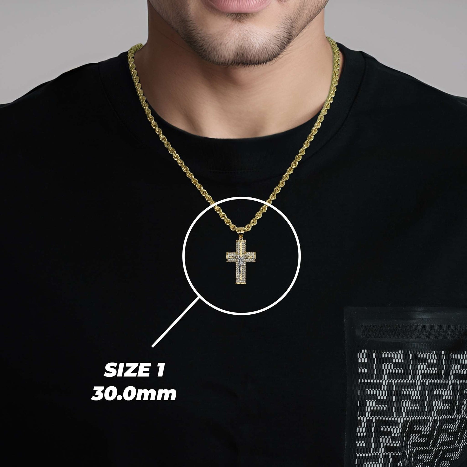 Model wearing a gold chain with the 30.0mm Yelca crucifix pendant highlighted in white.