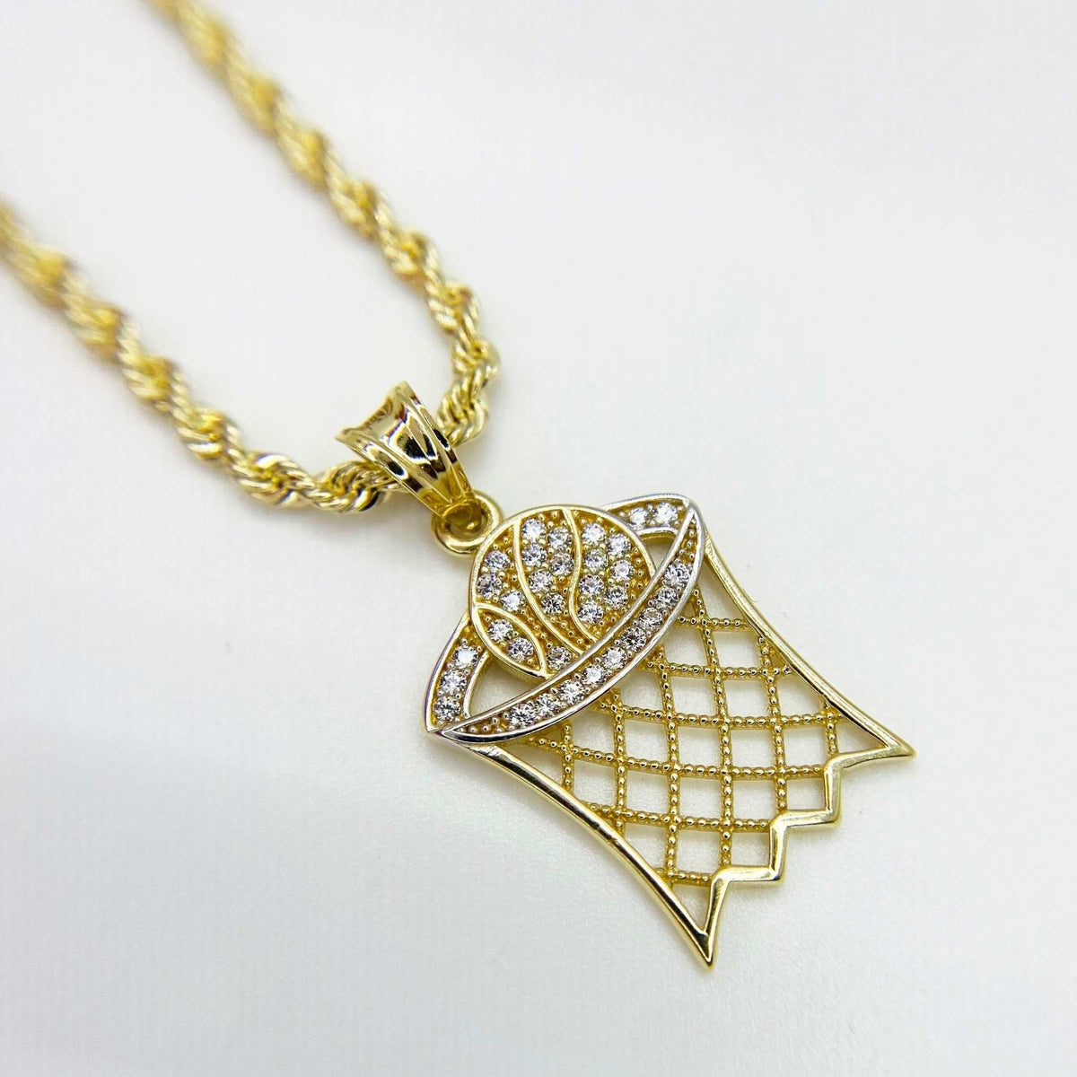 10k yellow gold basketball hoop pendant with cubic zirconia stones on a rope chain.