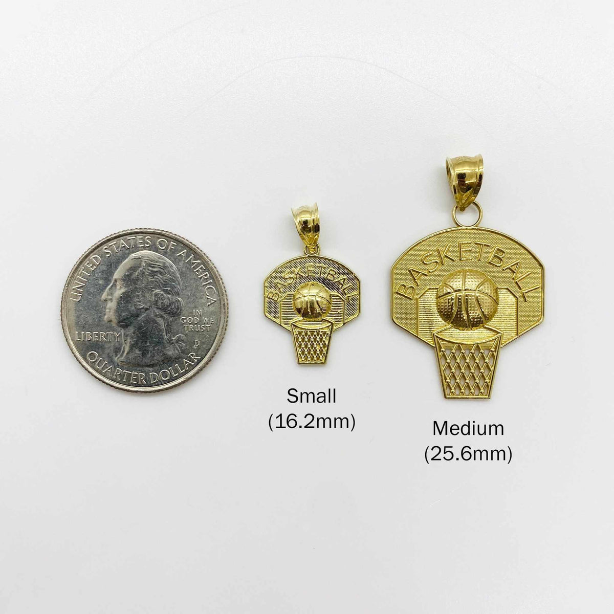 Small and Medium 10k gold basketball hoop pendants compared in size with a US quarter.