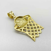 10k gold basketball hoop and net pendant charm featuring a textured ball and basket design.