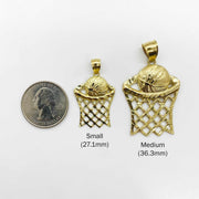 Size chart comparing Small and Medium gold basketball hoop pendants with a US quarter.