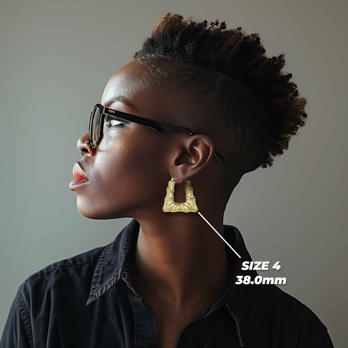 Model wearing a 38.0mm 10k gold bamboo square hoop earring for size reference.