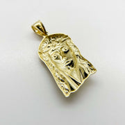 Back view of a 10k yellow gold Jesus Face pendant showing hollow structure.