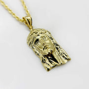 10k solid yellow gold Classic Jesus Face diamond-cut pendant displayed on a matching rope chain