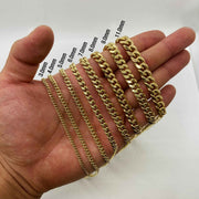 Width comparison chart of 10k solid gold Classic Miami Cuban link chains ranging from 3.0mm to 11.0mm held in hand.