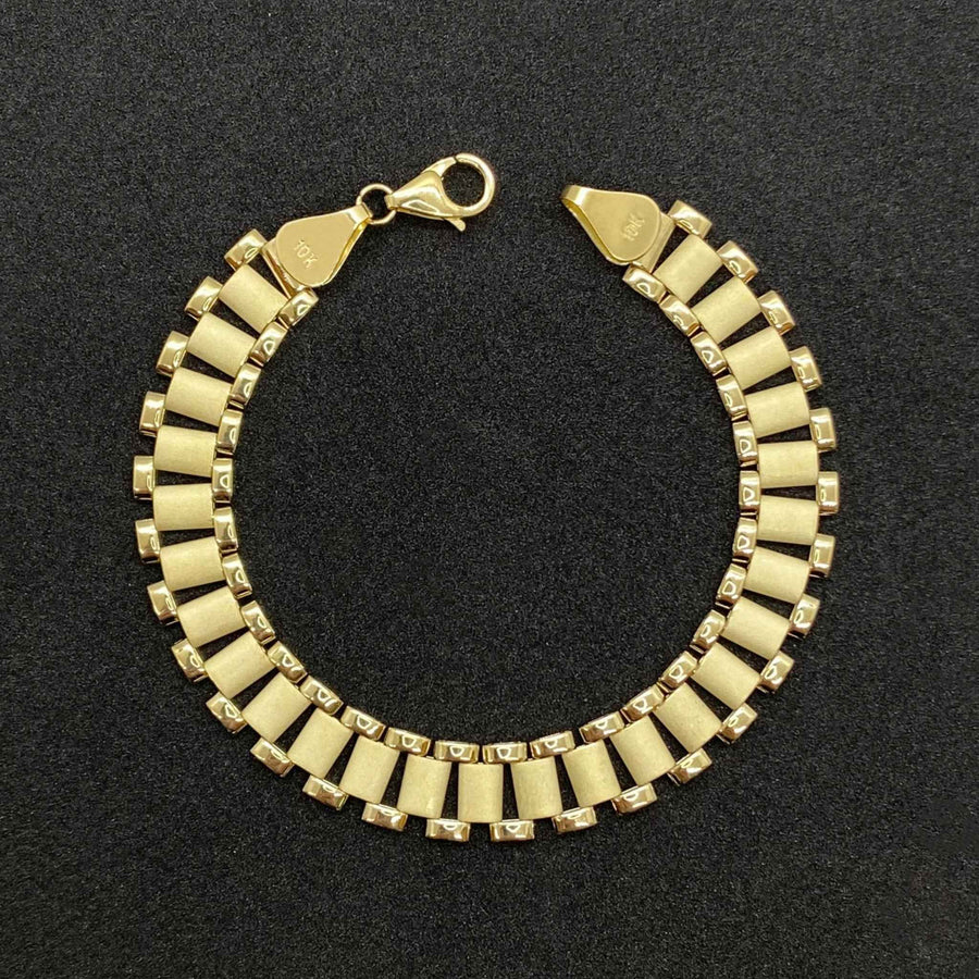 10k yellow gold Rolex chain bracelet displayed in a circular shape.