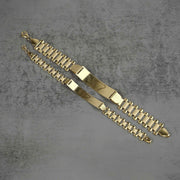 Top-down view of 10k yellow gold classic Rollie link personalized ID bracelets showing link structure and clasp attachments.