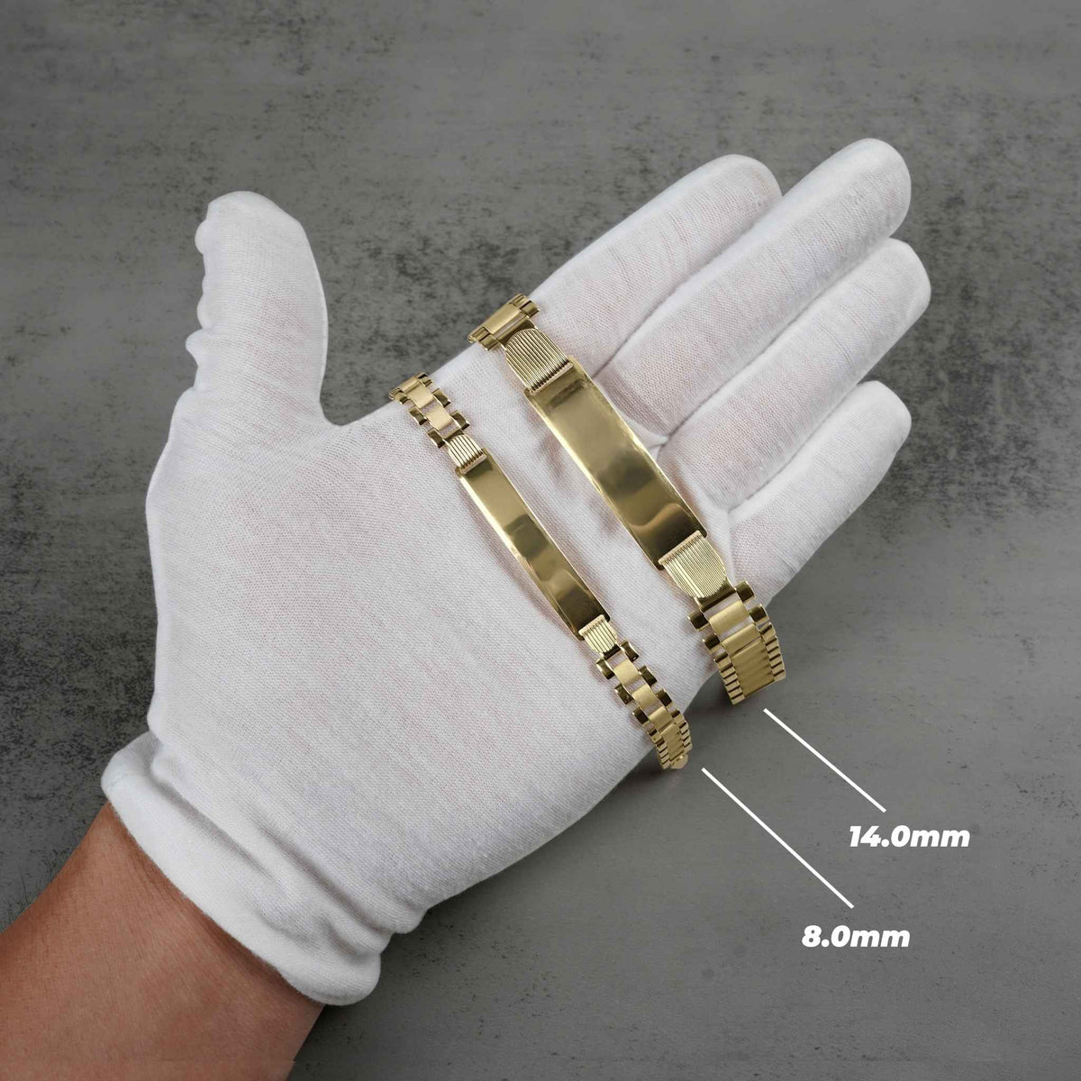Gloved hand displaying 8.0mm and 14.0mm 10k gold classic Rollie ID bracelets.