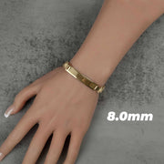Model wearing an 8.0mm 10k gold classic Rollie link ID bracelet over gray background.