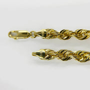 Close-up of 10k gold rope chain clasp and end cap stamped 10K.