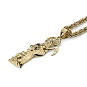 Angled view of a yellow gold Santa Muerte pendant attached to a thick rope chain.