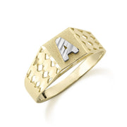 Gold initial ring featuring a textured white gold letter A and cut-out band.