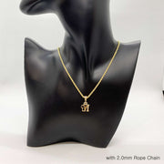 Gold crown initial 'M' pendant on 2.0mm rope chain on black mannequin bust.