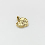 Back view of a 10k gold heart pendant featuring filigree lattice work and 10K stamp.