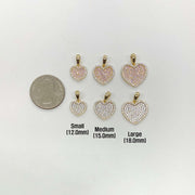 Size chart for 10k gold heart pendants with US quarter for scale.