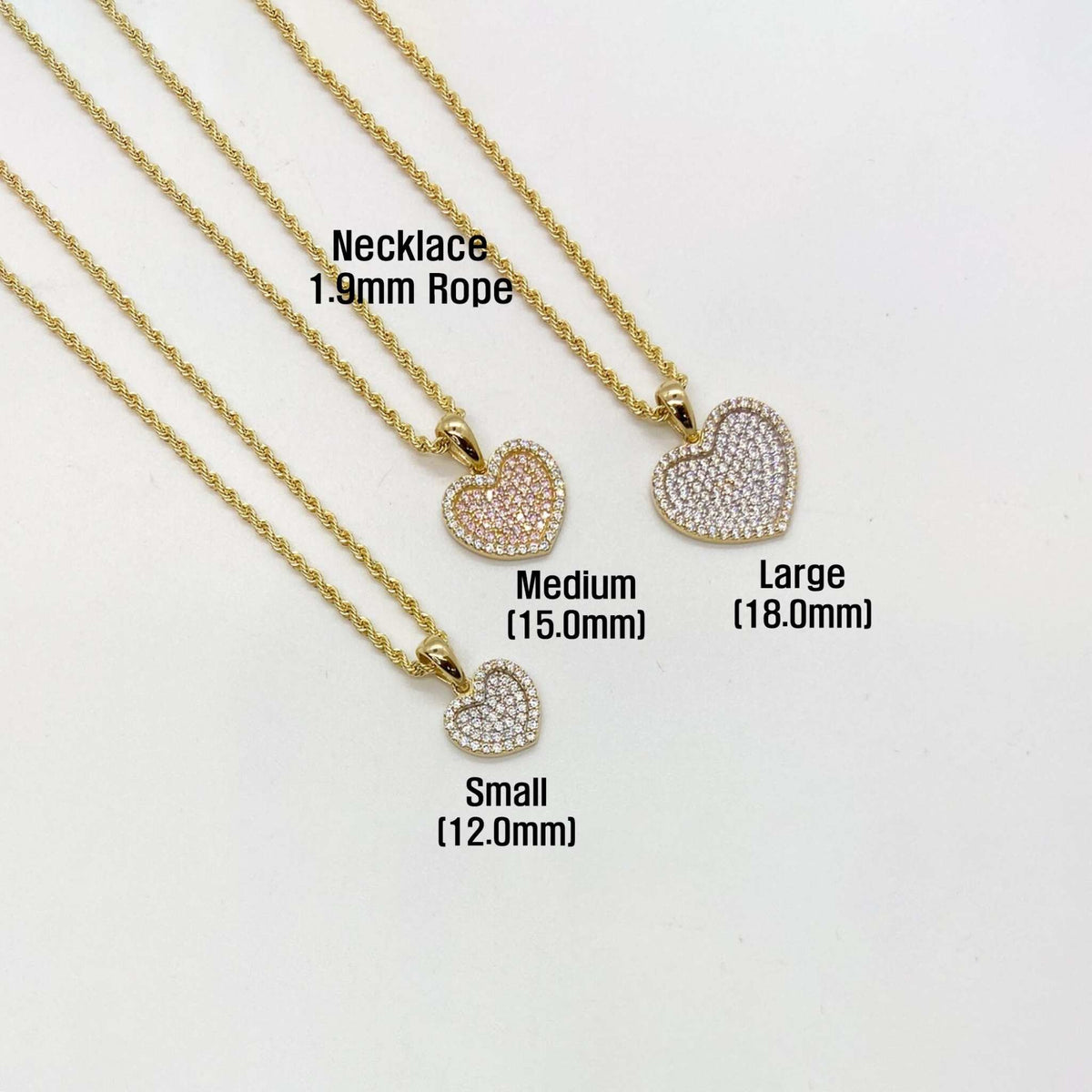 Small, Medium, and Large CZ gold heart pendants on rope chains.