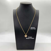 Medium gold heart CZ pendant on a 1.9mm rope chain displayed on a mannequin.