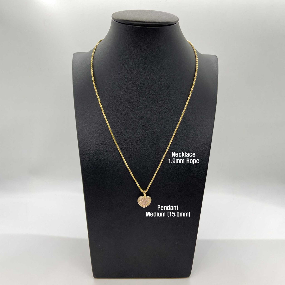 Medium gold heart CZ pendant on a 1.9mm rope chain displayed on a mannequin.